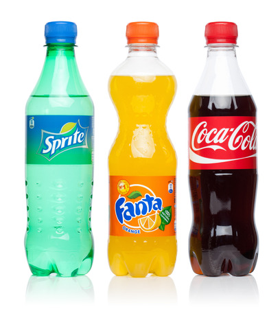 ESTONIA - AUGUST 16, 2014. Coca-Cola, Fanta and Sprite bottles, isolated on the white background.The three popular drinks produced by the Coca-Cola Company.のeditorial素材