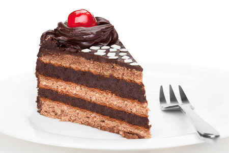 Piece of chocolate cake with cherry decoration,  isolated on the white background.の写真素材