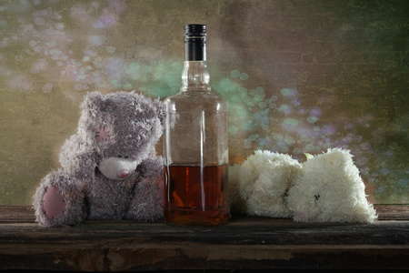 Two Teddy Bears drunk bourbon whiskey at Christmasの写真素材