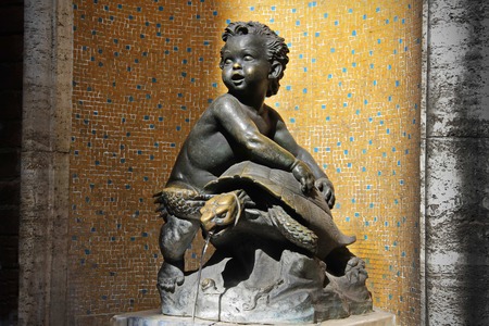 Fountain of child astride a turtle in Siena, Toscana, Italyの写真素材