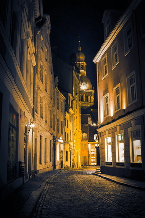 Night in old Riga - famous European city where tourists can find a unique atmosphere of Middle Ages and famous ensembles of architectureの写真素材
