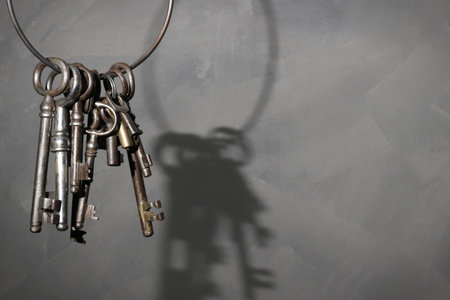Old antique vintage key on rustic background