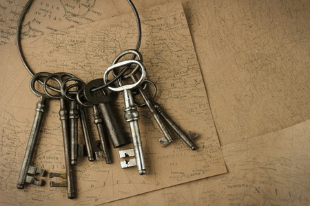 Old antique vintage key on rustic backgroundの写真素材