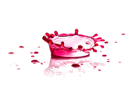 Red wine splash isolated on white backgroundの写真素材