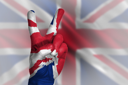 Hand making victory sign, united kingdom painted with flag as symbolの写真素材