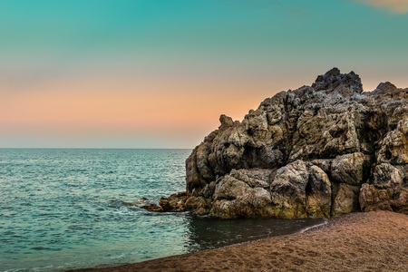 Sunrise on the beach of Calella near Barcelona, Catalonia province, Spainの写真素材