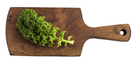 kale leafy vegetable closeup on a wooden cutting board