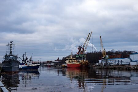 LIEPAJA, LATVIA - January, 2018: Liepaja seaport with port cranes.のeditorial素材