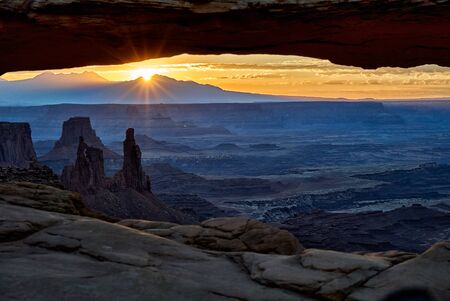 Sunrise behind Mesa Arch at Canyonlands National Park, Iceland in the Sky, Moab, Utah, USA, North Americaの写真素材