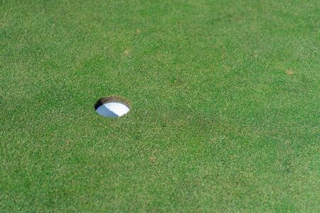 Golf hole with green grassの写真素材