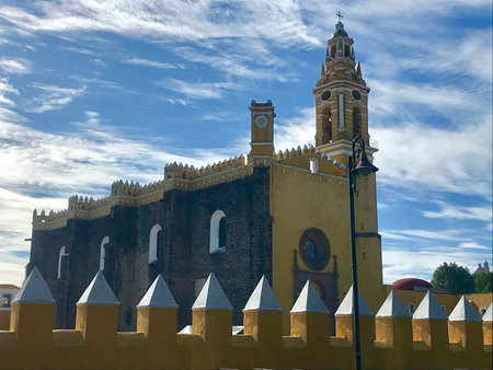San Gabriel Arcangel convent with a blue sky and some clouds in Cholula, Puebla, Mexico