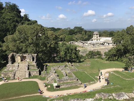 View of Palenque archaeologic area in Chiapas Mexico with some trees and the sky with cloudsの写真素材