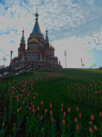  Orthodox church with blooming tulips                              の写真素材