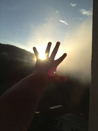 Sunrise view with left handの素材