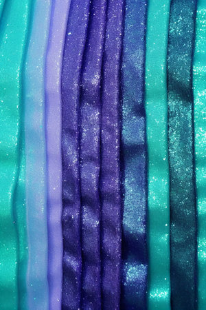 Colorful fabric background. Close-up of bright satin fabric texture.の素材