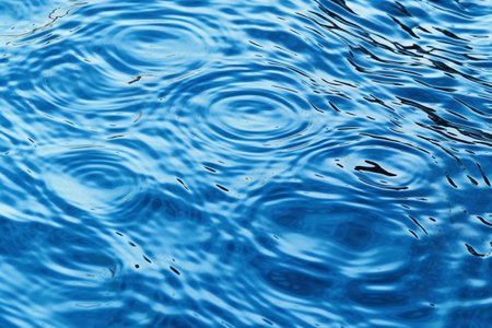Water ripples on a blue water surface. Texture of water.の素材
