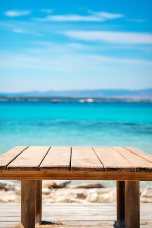 Wooden table with sea view background. Empty table for product display montageの素材