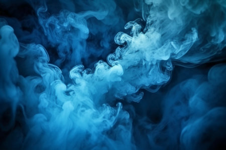Blue steam on a black background. Copy space. Toned.の素材