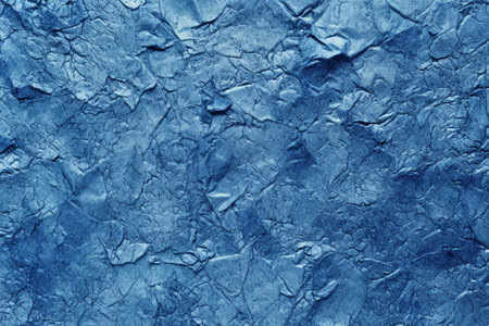 Crumpled paper texture in blue tone. Abstract background and texture for design.の素材