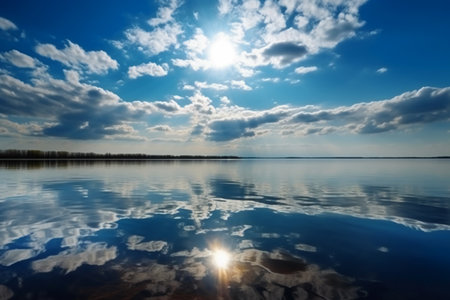 Sunset on the lake. Reflection of clouds in water.の素材