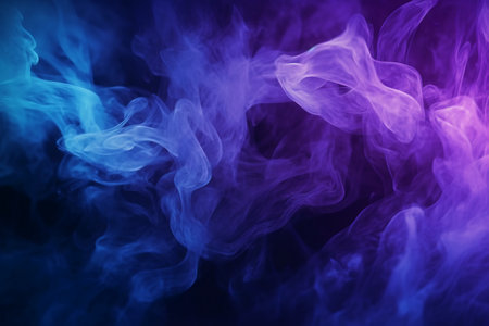 Dense multicolored smoke of blue and purple colors on a black isolated background. Background from the smoke of vapeの素材