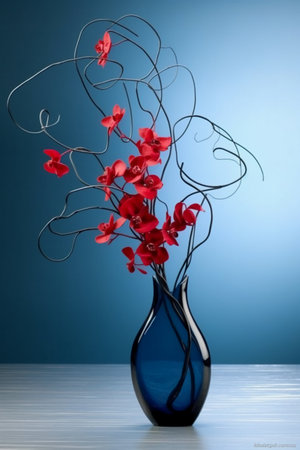Beautiful red orchid in blue vase on blue background.の素材