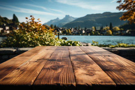 Wooden table in front of blurred background of lake Lucerne, Switzerlandの素材