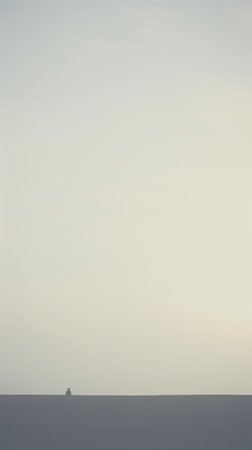 An image of a boat in the middle of the sea at sunsetの素材