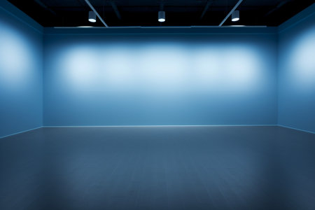 Blue wall and floor in empty room with spotlights, abstract backgroundの素材