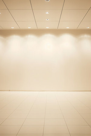 Blank wall in modern office building interior with light spotlights.の素材
