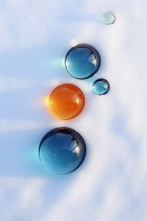 crystal balls in the snow, closeup of photo with shallow depth of fieldの素材
