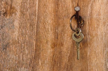 key with wood backgroundの写真素材