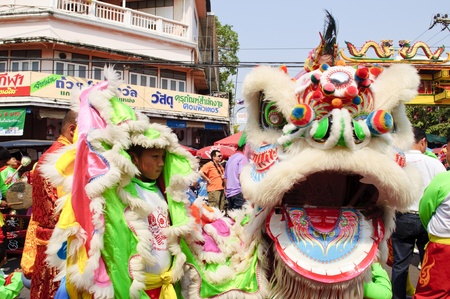 Nakhon Sawan, Thailand - February 6,2011 -  acrobatic lion dancers show with the crowd in chinese new year celebrationのeditorial素材