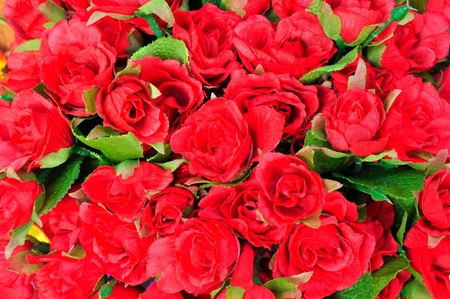 Artificial red rose flowers backgroundの写真素材