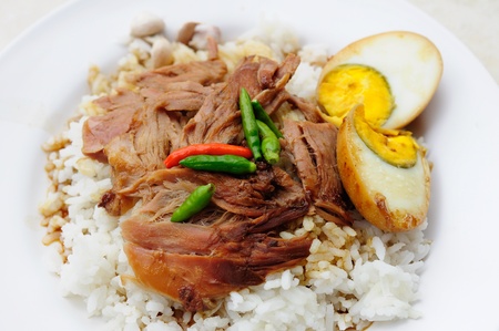 grilled knuckle of pork on riceの写真素材