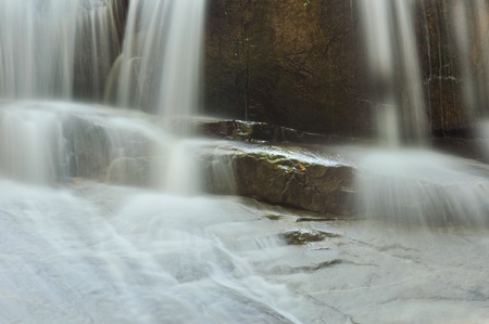 Beautiful cascading waterfall over natural rock and spaceの写真素材