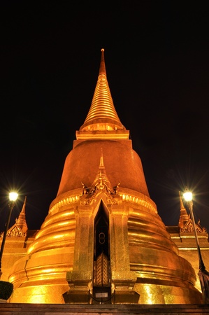 Phra Sri Ratana Chedi coverd with foil gold in the inner Grand Palace at the night , Bangkok, Thailandの写真素材