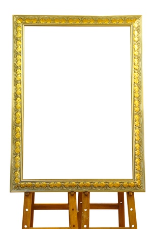 Vintage gold picture frame with wooden easel isolated on white backgroundの写真素材