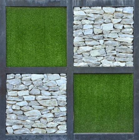 grass and stone wall backgroundの写真素材