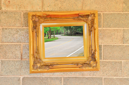 curve road in Vintage picture frame on the wall
