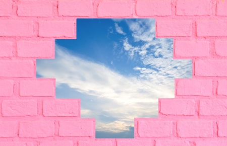 Pink brick wall with blue skyの写真素材