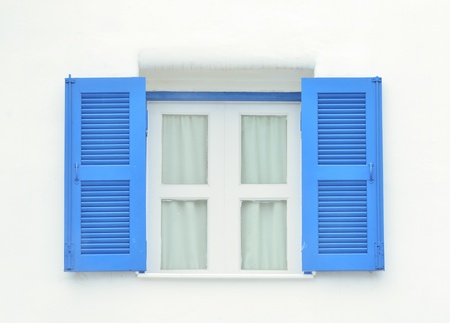 Beautiful wooden window on white concrete wallの写真素材