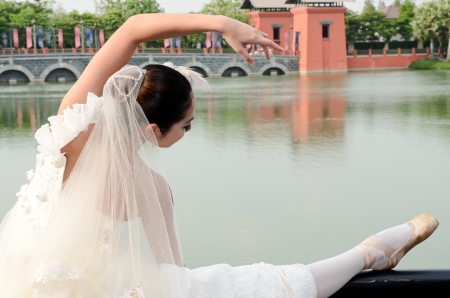Beautiful girl in white gown of the bride danceの写真素材