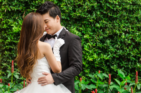 Groom and bride in the beautiful gardenの写真素材