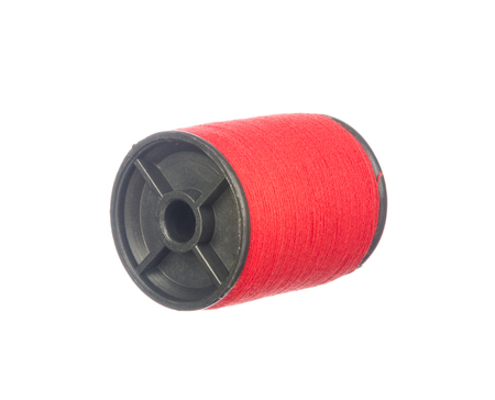 Colourful red thread isolated on white backgroundの写真素材