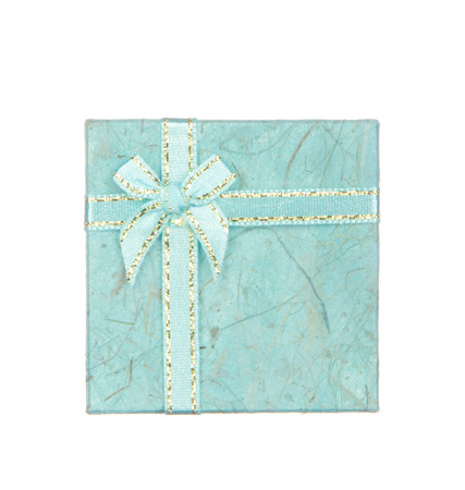 Blue gift box with ribbon and bow isolated on white backgroundの写真素材