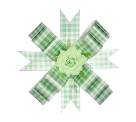 Green ribbon bow with flower isolated on white backgroundの写真素材