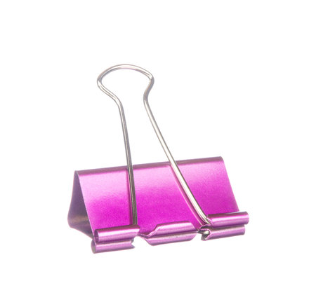 Purple paper clip isolated on white backgroundの写真素材