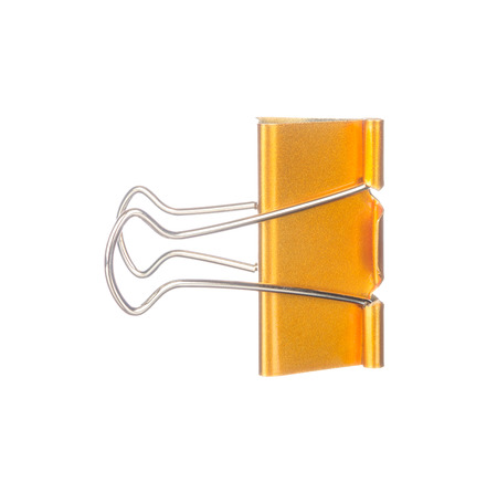 Yellow paper clip isolated on white backgroundの写真素材