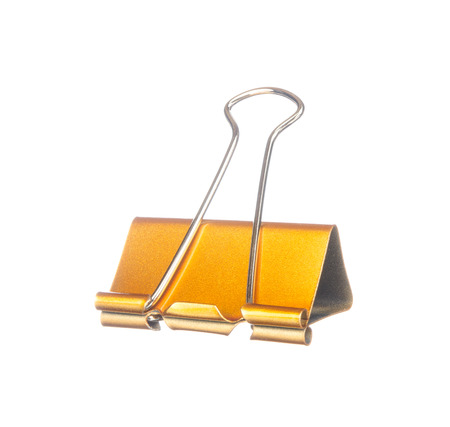 Yellow paper clip isolated on white backgroundの写真素材